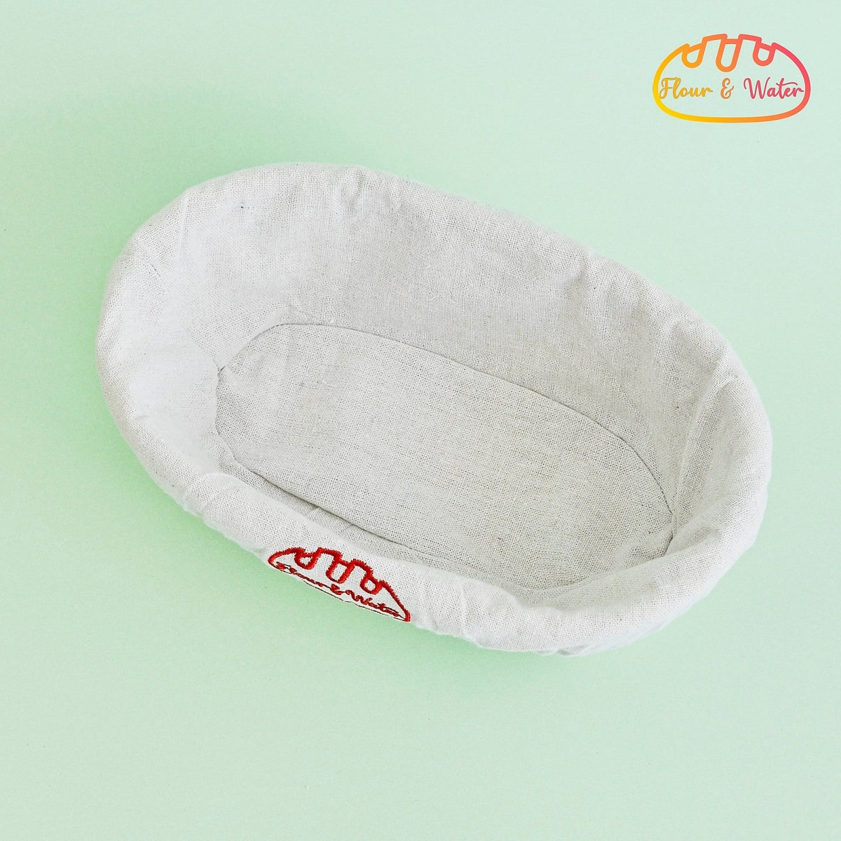 Cloth liner fitted inside an oval banneton, top view