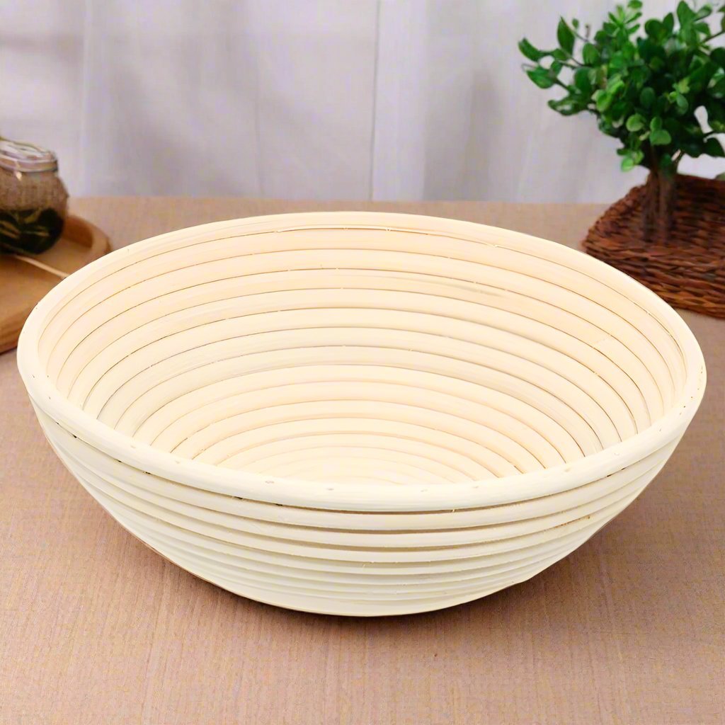 Round rattan banneton on a wooden kitchen bench