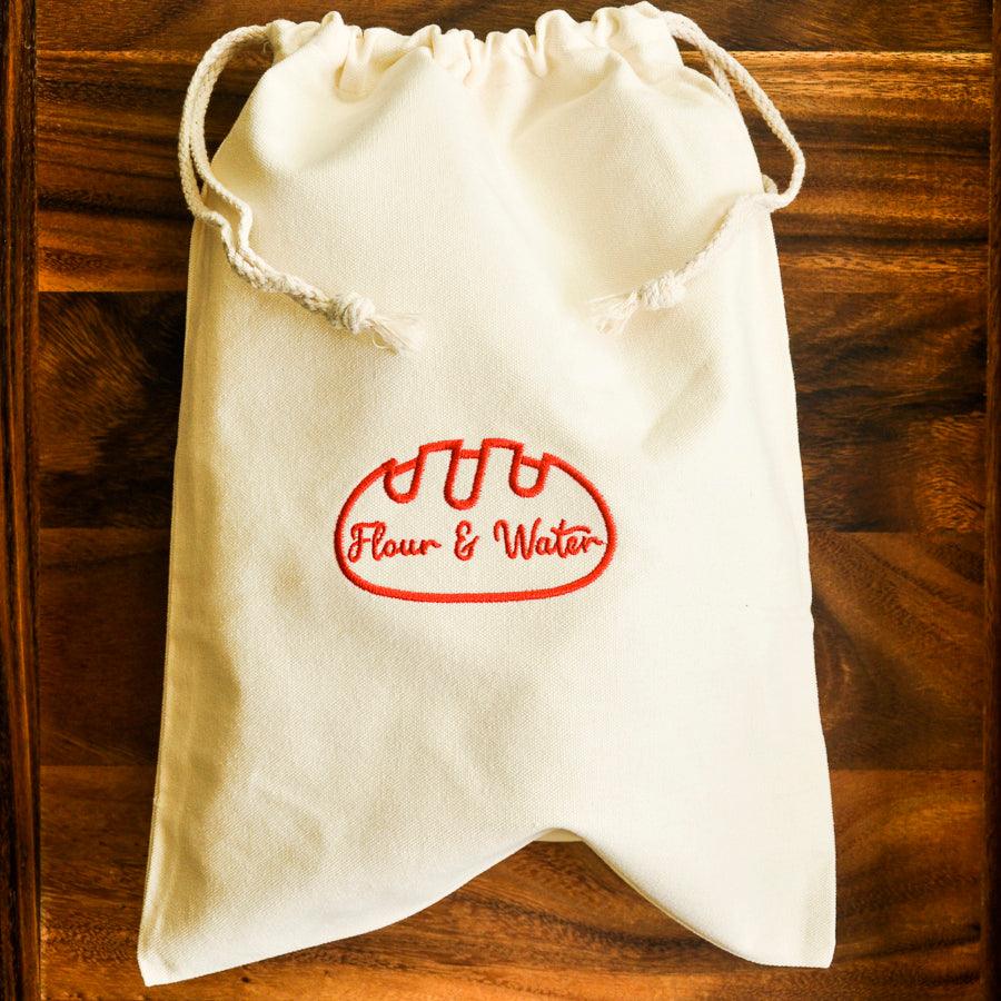 Canvas bread bag on a dark wooden table