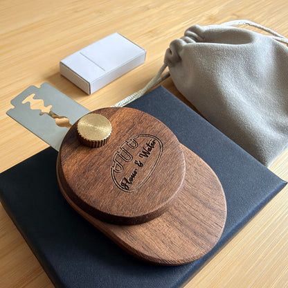 Walnut swivel bread lame with Flour & Water logo on black gift box