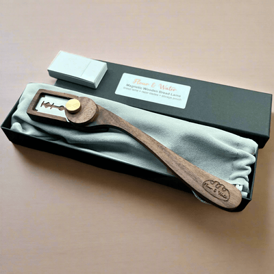 Magnetic walnut bread lame in its black gift box with storage pouch and blades