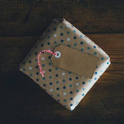 Gift-wrapped sourdough order with a brown paper tag