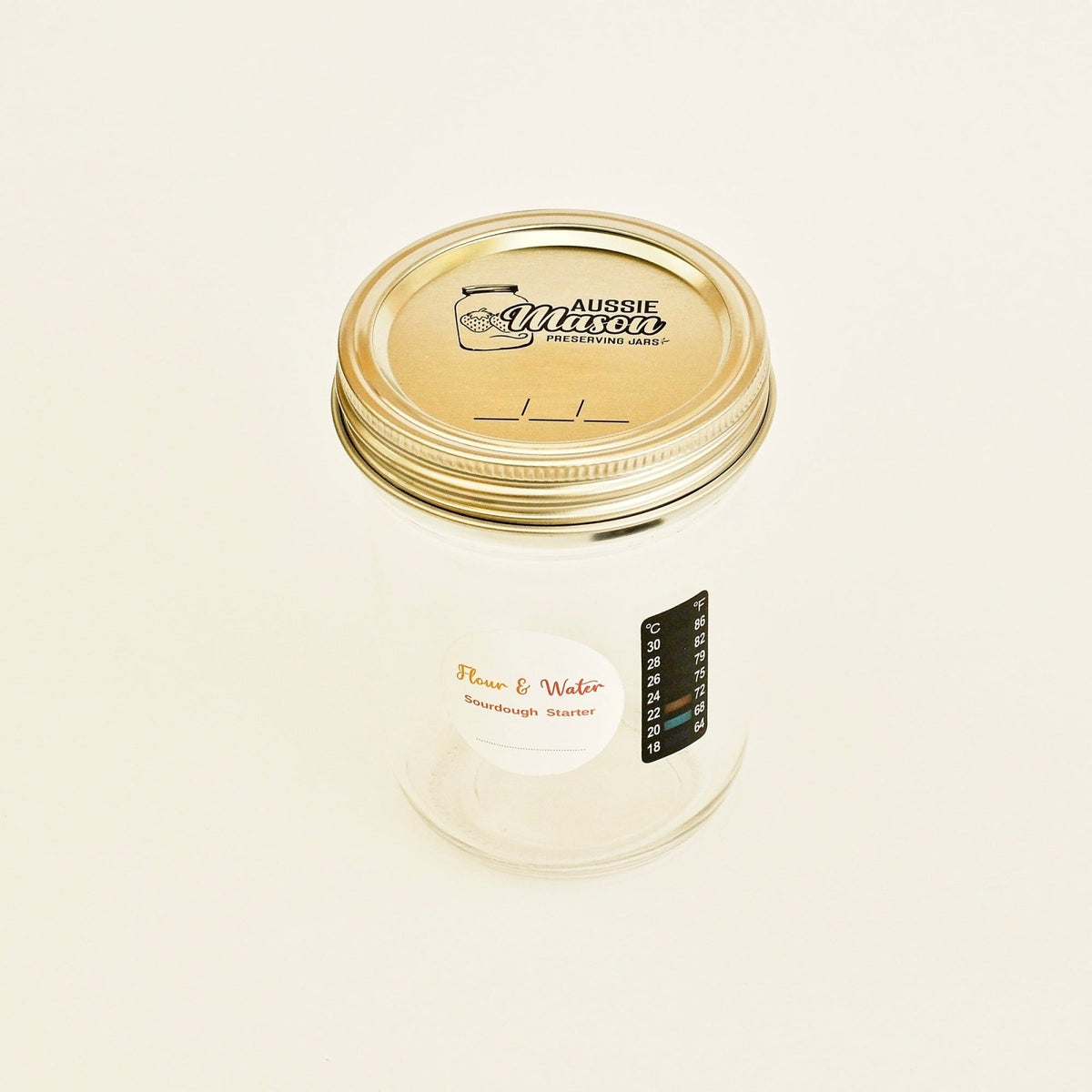Mason starter jar with Flour & Water label and lid