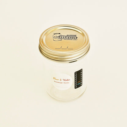 Mason starter jar with Flour & Water label and lid