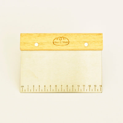 Stainless steel bench scraper with oak handle and ruler markings